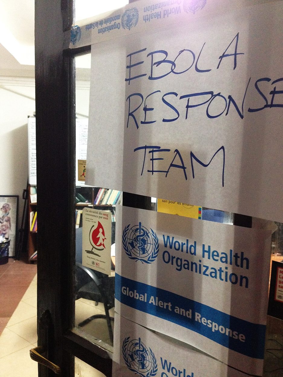 CDC documentary image of World Health Organization field-response presence during the 2014 Ebola outbreak in West Africa; not an event from 2026. Documentary photograph; original source credited to CDC / Daniel J. DeNoon.